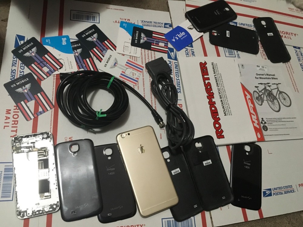 Lot of items. Ps2 extendercord phone shells, manuals (20 plus items) r e a d
