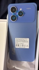 Is a fuffy iPhone, is purple with kind of blue has 3big cameras, is not used,