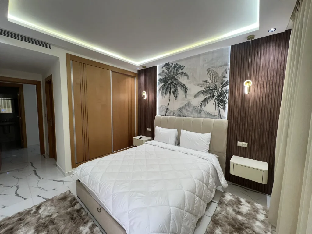 Master bedroom walnut wood palm mural accent wall