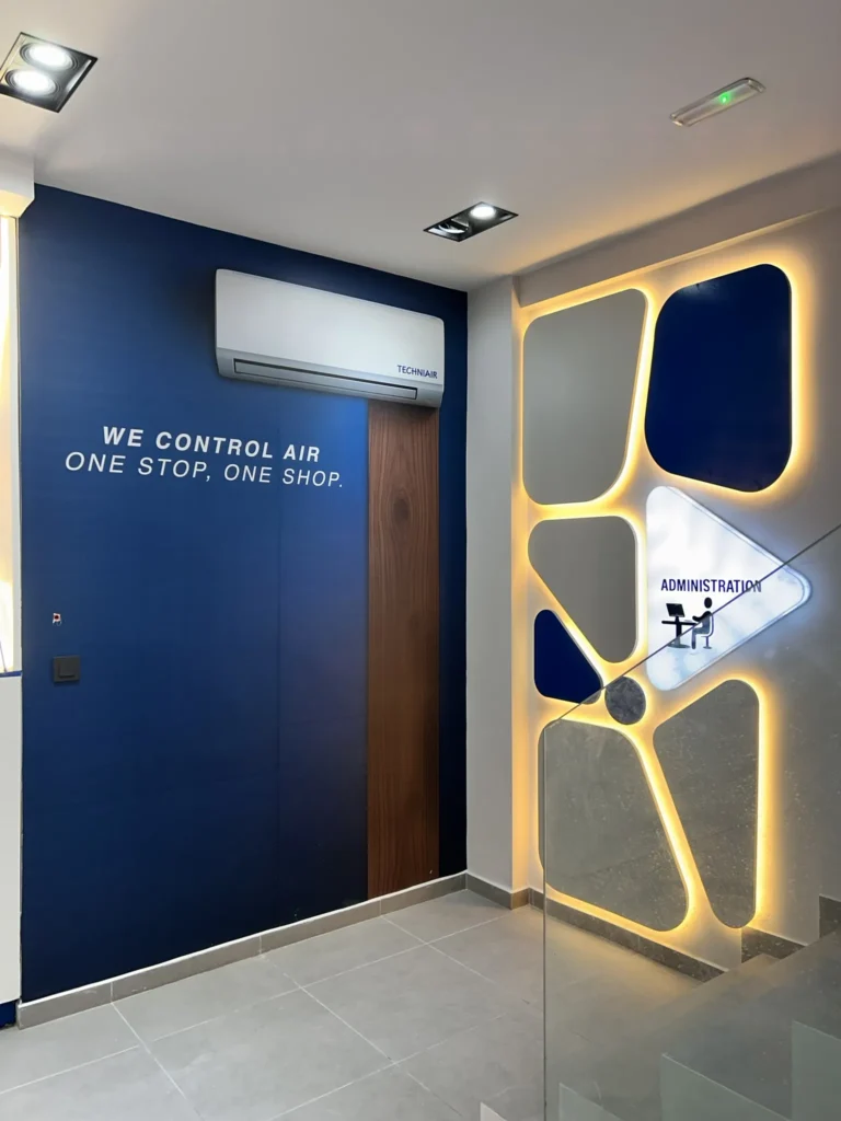 Techniair showroom blue feature wall wood door